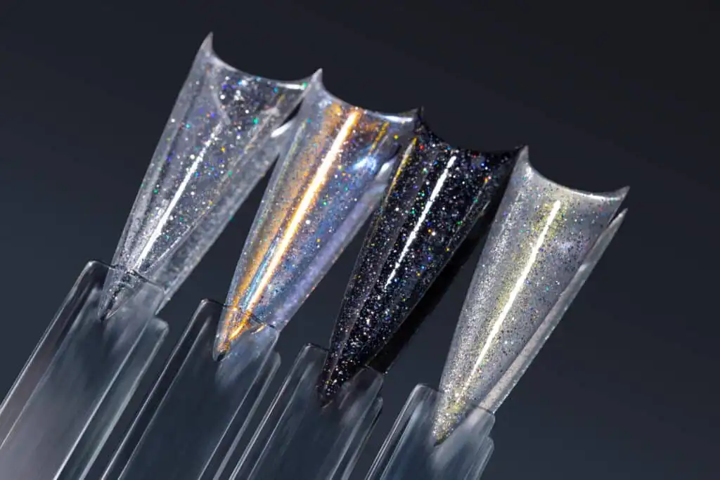 JTING NAIL #01 Stellar Dust Glitter Top Coat - High-density silver diamond shimmer effect on clear and black base colors.