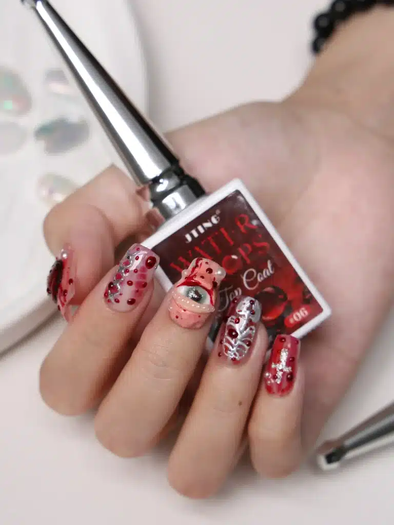 Avant garde gothic eyeball nail art with hyper realistic blood droplets using JTING shade 06