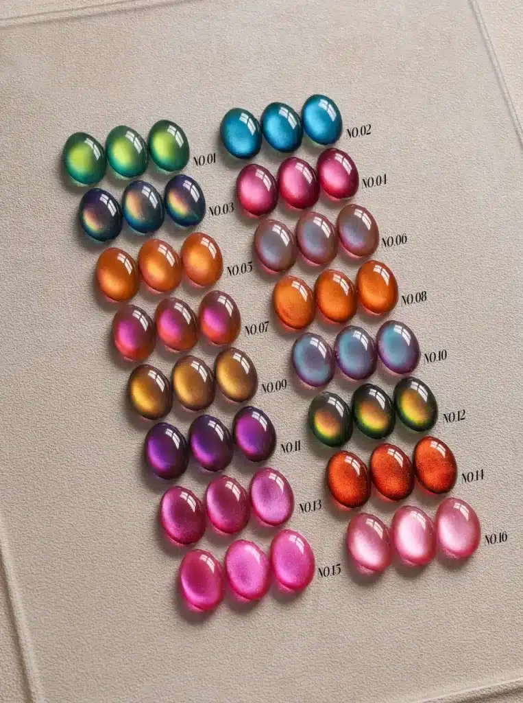 Systematic studio catalog display of the 16-color JTING HEMA-free and TPO-free glass aurora cat eye collection for B2B distributors