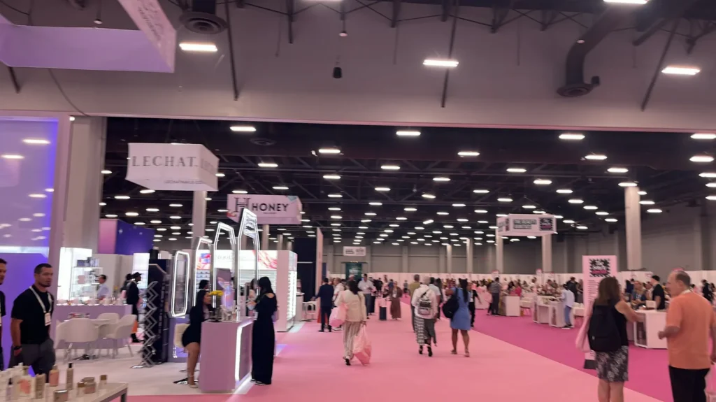 Wide view of the premium nail pavilion at Cosmoprof Las Vegas showcasing advanced gel formulations and salon setups