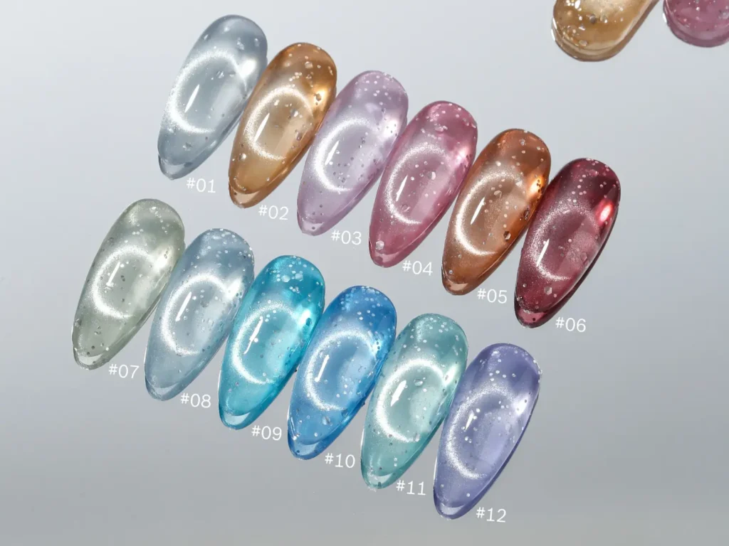 Twelve sharp stiletto nail swatches displaying perfect circular ring light reflections over a smooth self leveled cat eye gel surface