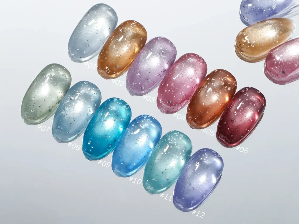 High gloss stiletto nail tips showing rich integrated bubble sequins and bright white magnetic pigments under direct light without surface graininess