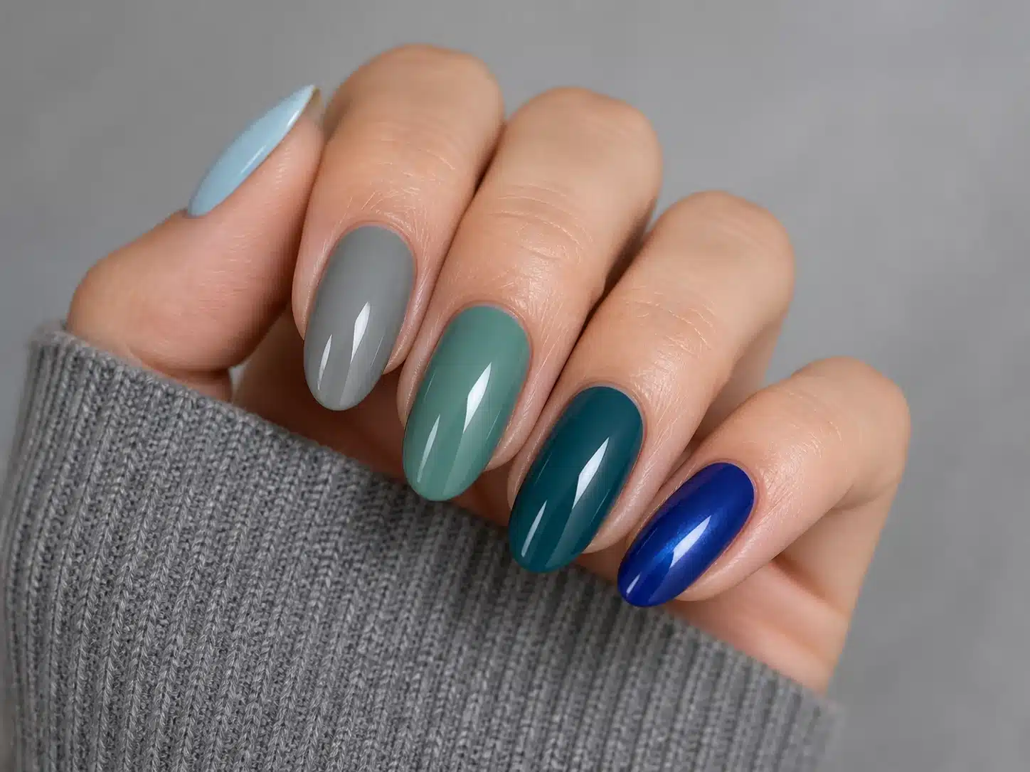 JTING A05 cobalt midnight blue teal and slate gel nail polish shown on a hand