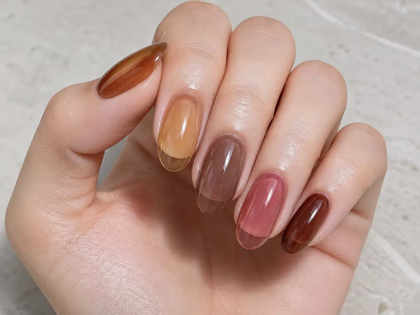 Caramel tea hazelnut rosewood and cocoa jelly gel nail polish shown on a hand