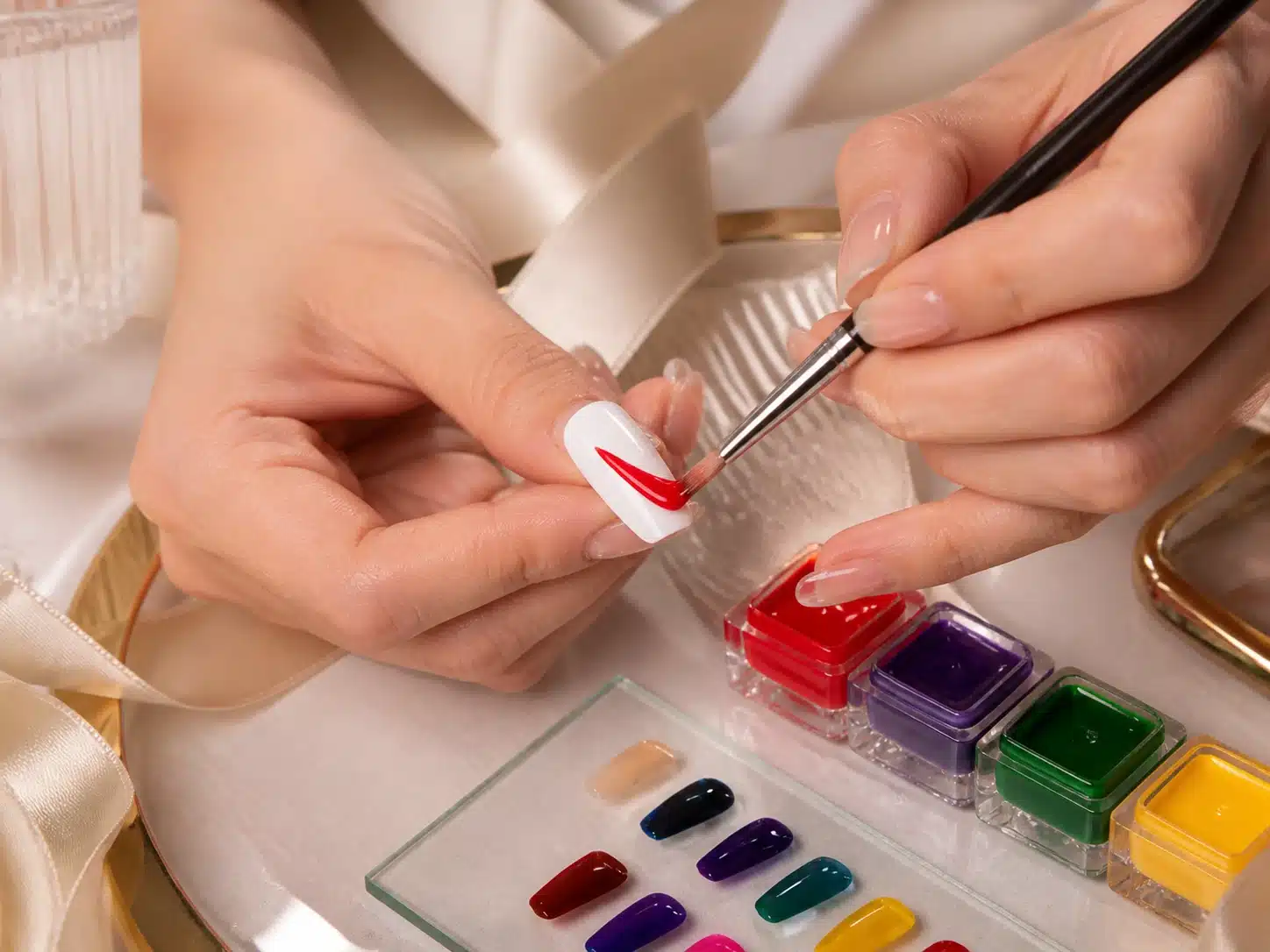 Professional painting gel brush application technique on a prepared nail tip