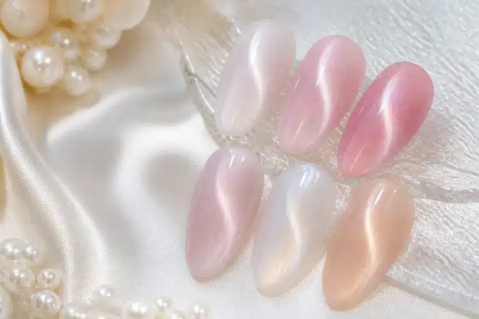 White milky and rosy cat eye gel polish effects