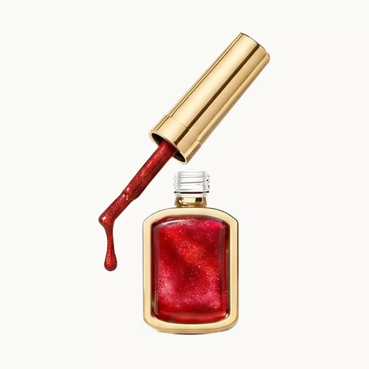Gold-trimmed bottle showing red gel, with a gold cylindrical cap and a brush coated in red gel.