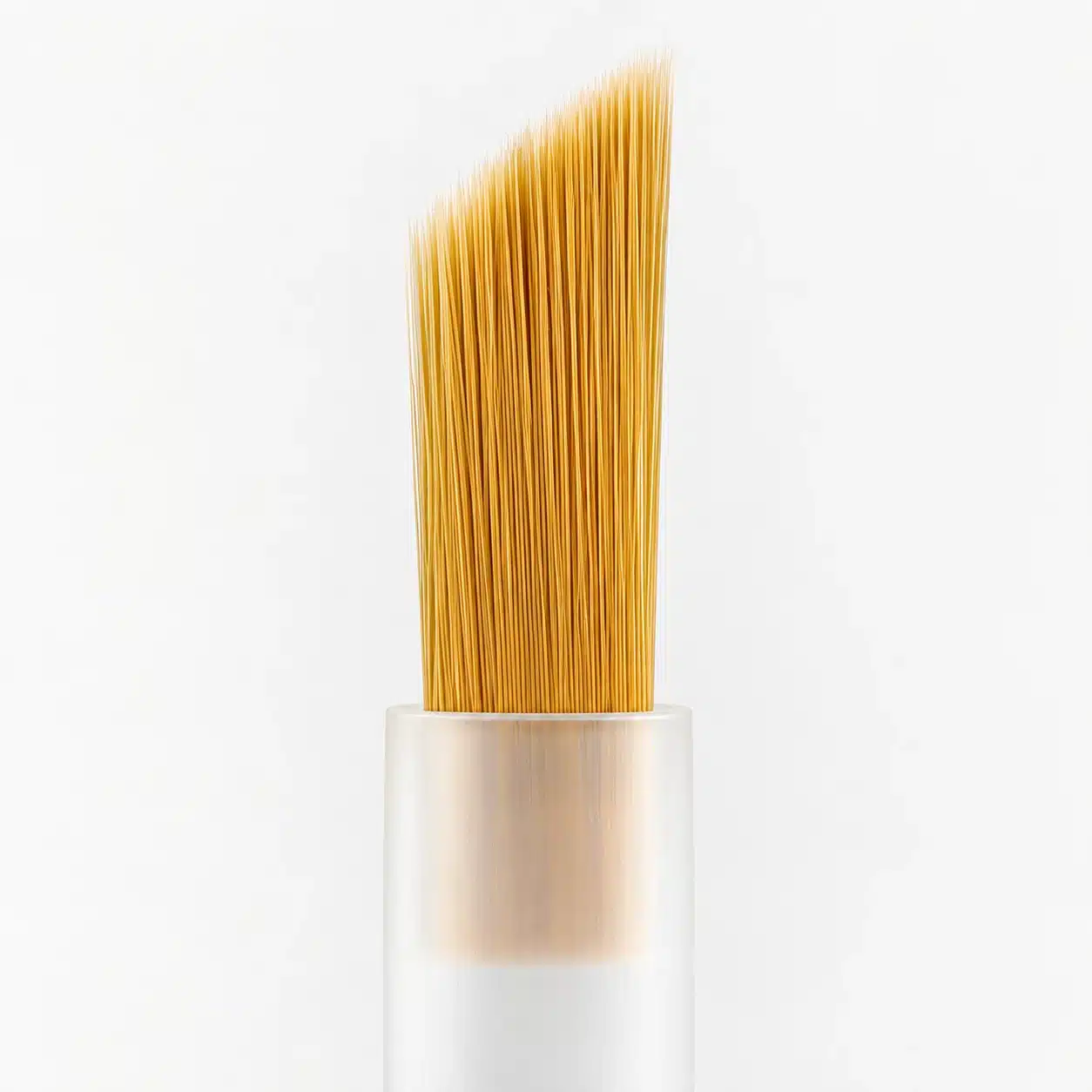 Golden yellow bottle brush with a slanted bristle edge and translucent plastic stem.