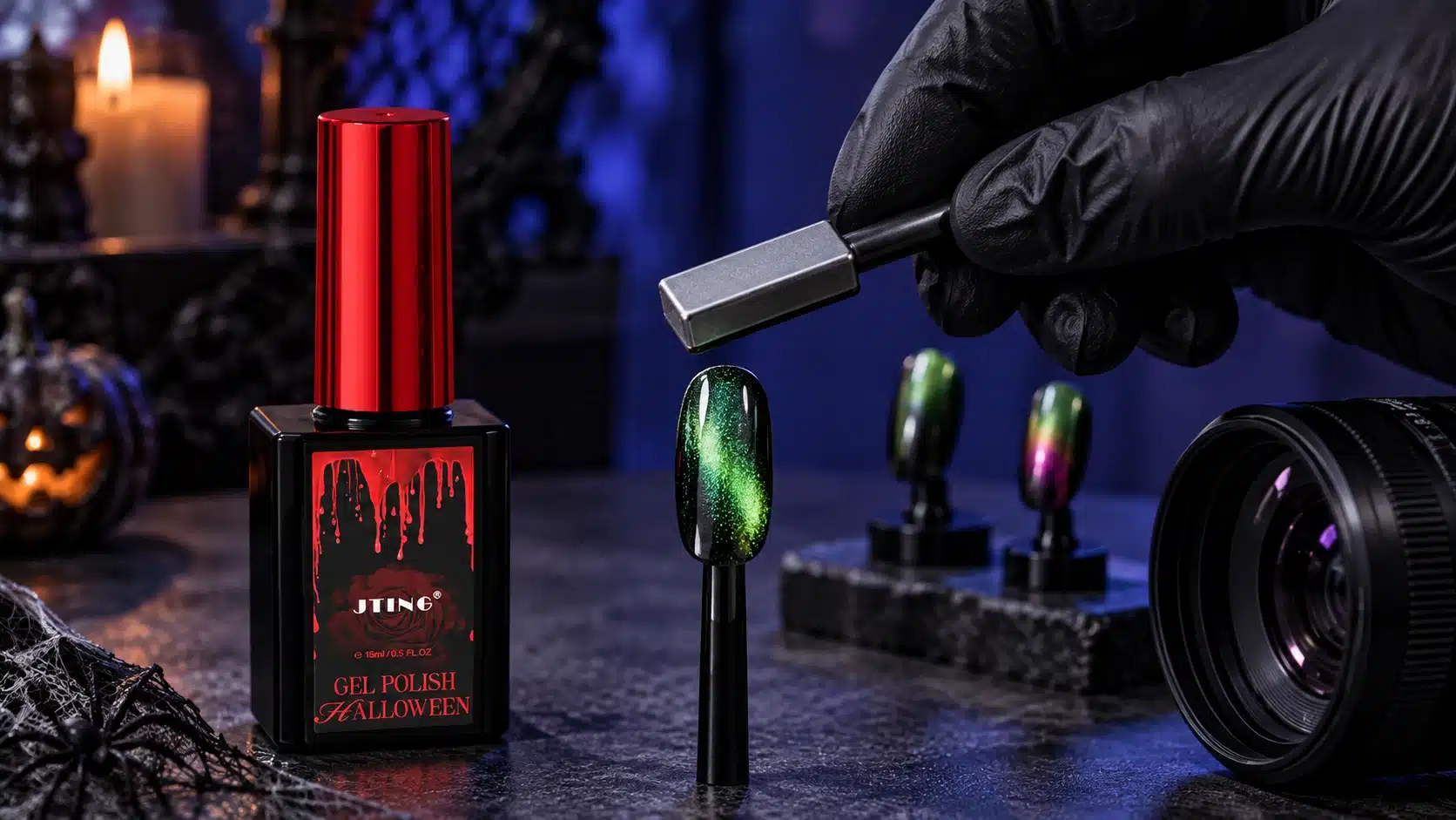 Gloved hand positioning a magnet above a green cat-eye nail sample beside JTING Halloween gel polish
