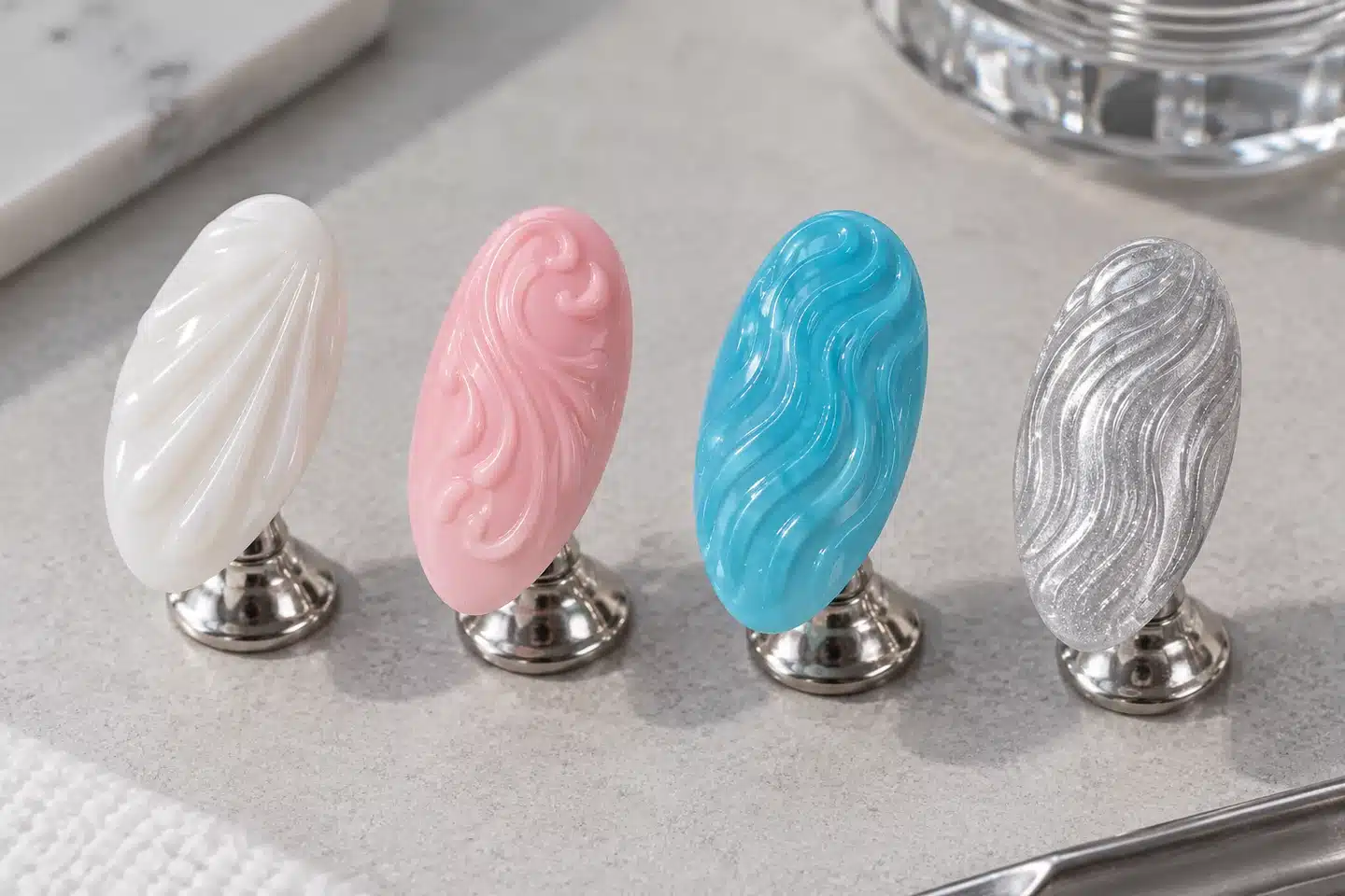 White shell ridges, pink embossed curves and blue and silver ripple nail designs