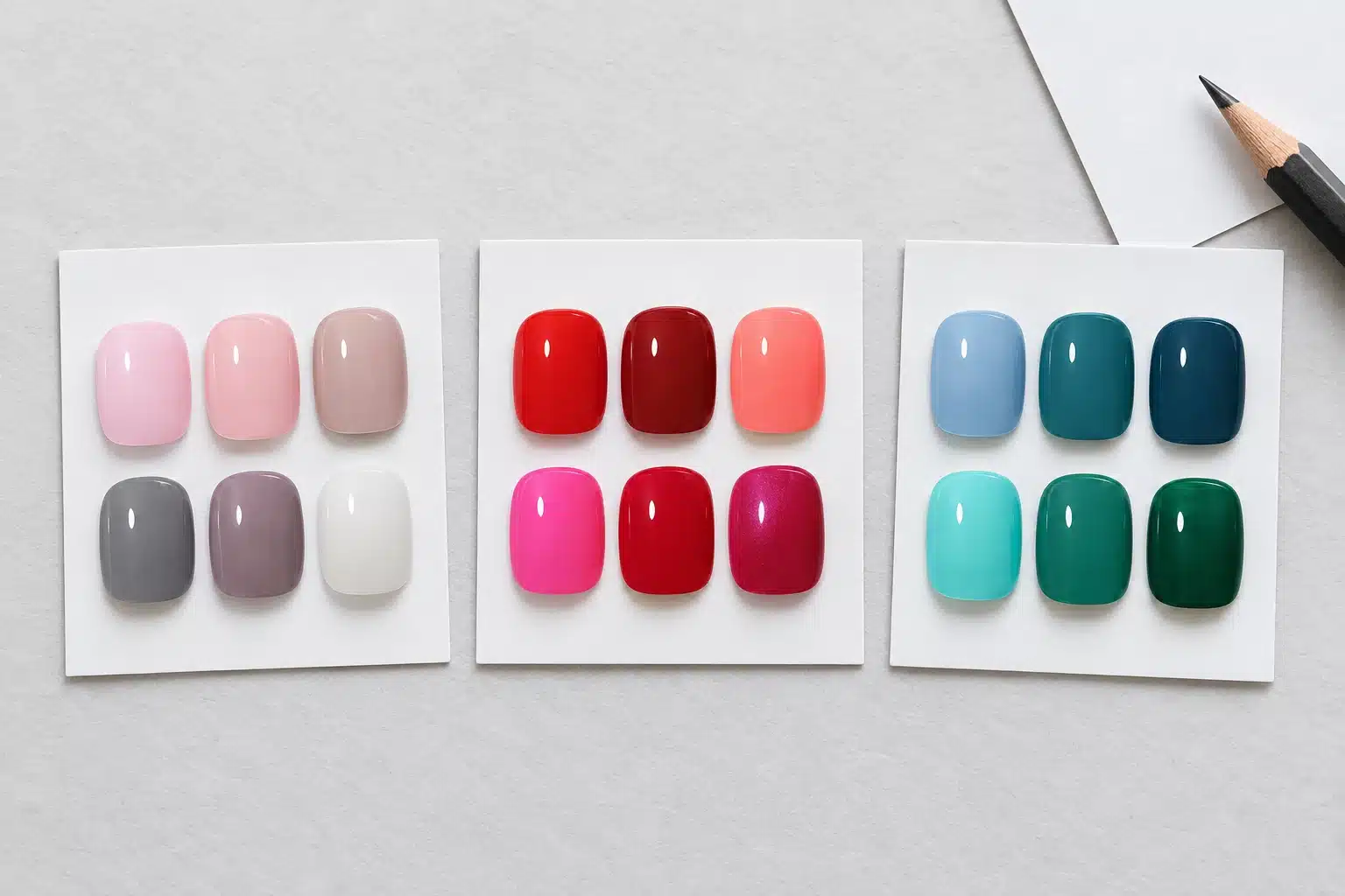 Eighteen gel nail polish swatches grouped into neutrals, red and pink shades, and cool blue and green colors