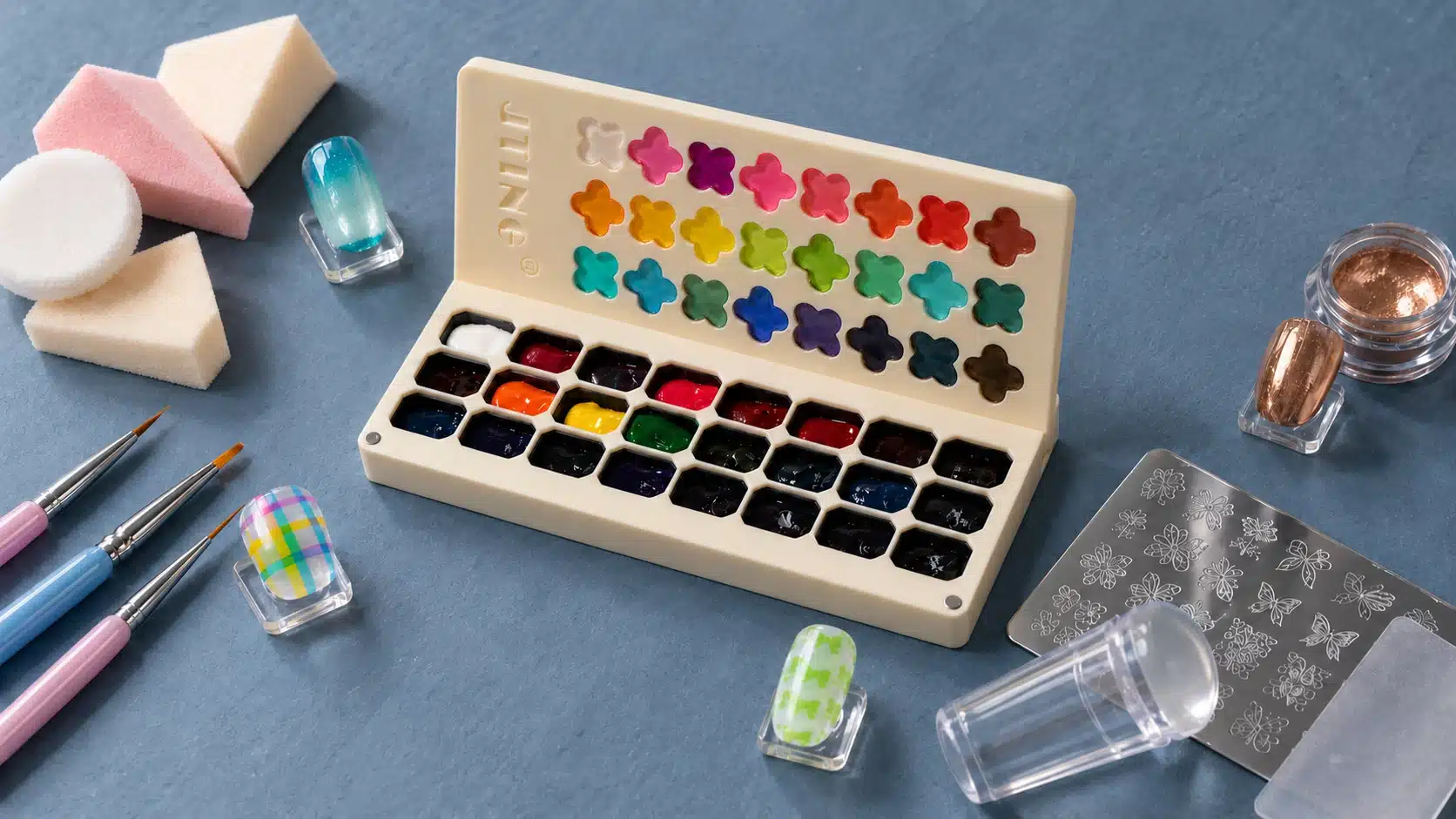 JTING pat pat gel palette with sponges, detail brushes, stamping tools and a separate chrome powder pot