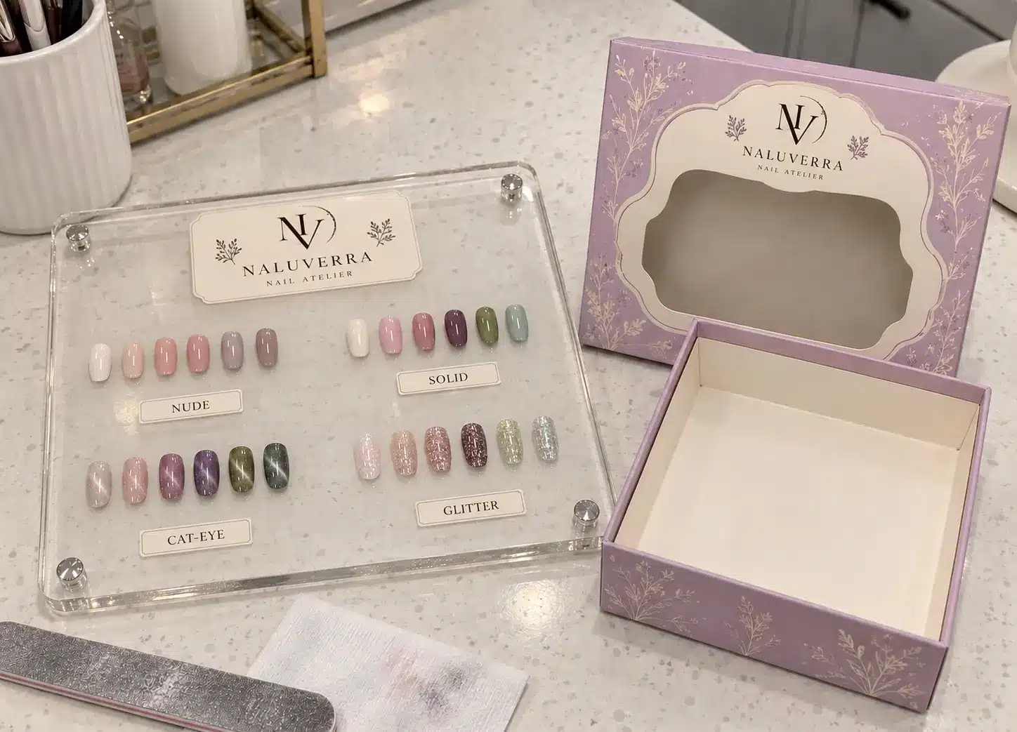 A thick acrylic shade board beside the salon’s original square storage box