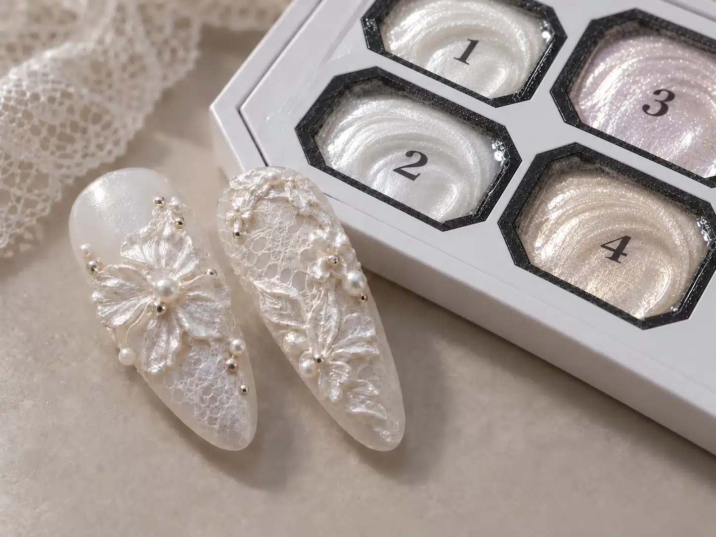 Milky-white Dusty Pink Sculpture Gel beside two nail tips with pearlescent flower and lace relief details