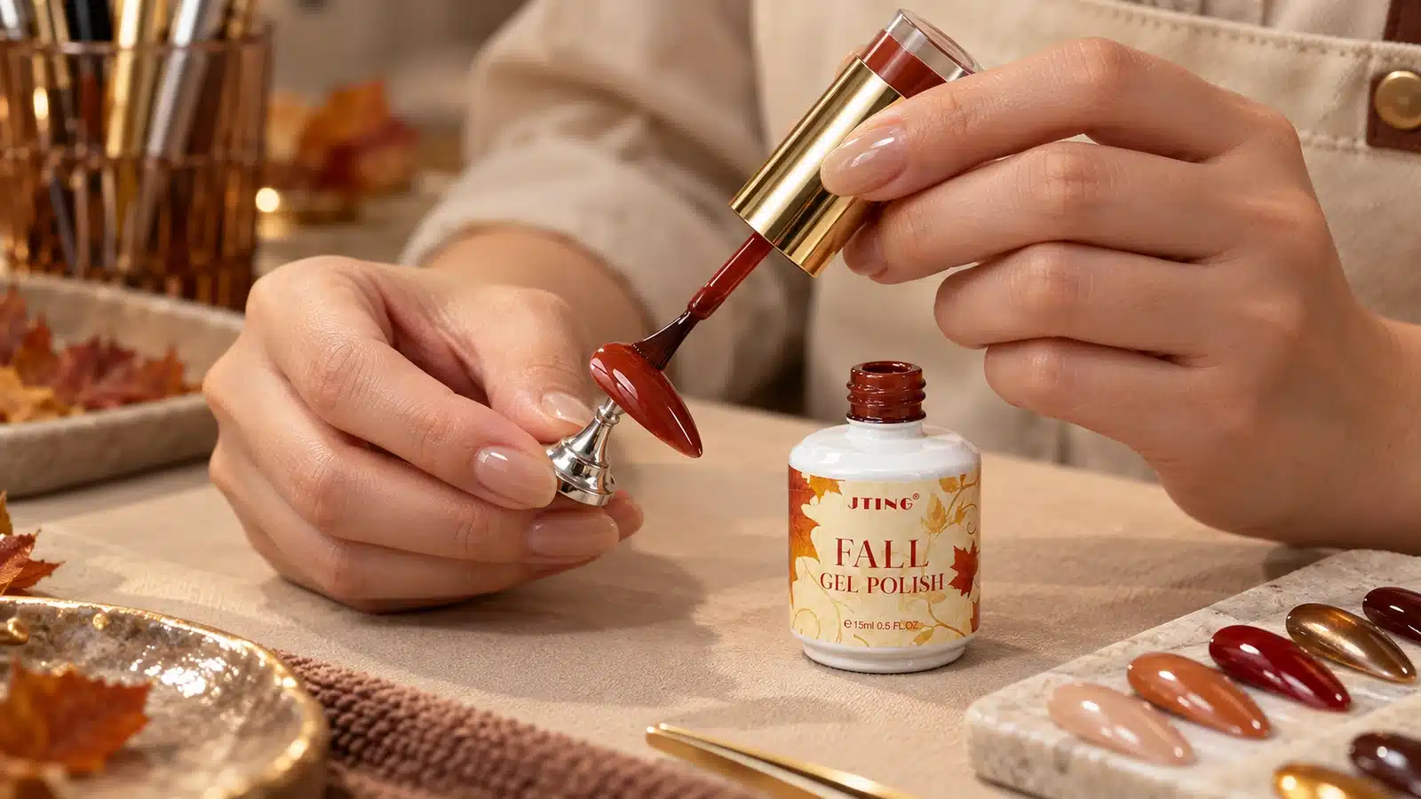 Technician brushing red-brown gel onto a nail sample beside an open JTING bottle