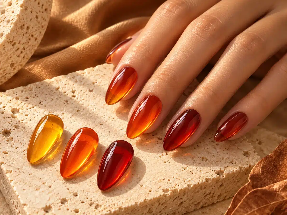 Translucent amber and red-brown jelly gel manicure with matching nail samples