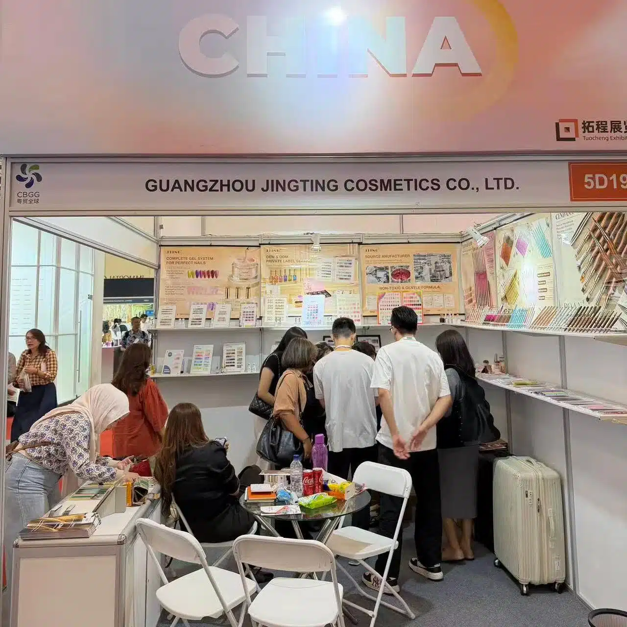 Visitors viewing nail products at the JTING booth at a beauty exhibition in Indonesia