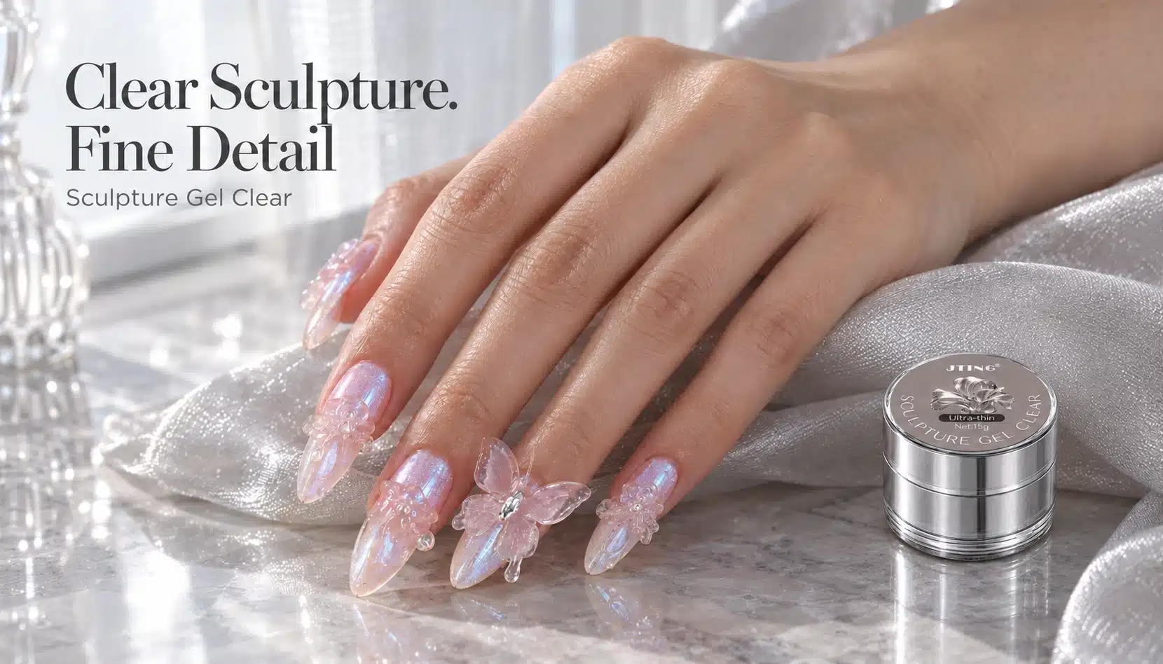 JTING Sculpture Gel Clear Collection Hand wearing clear rose and butterfly nail art beside a silver JTING Sculpture Gel Clear jar