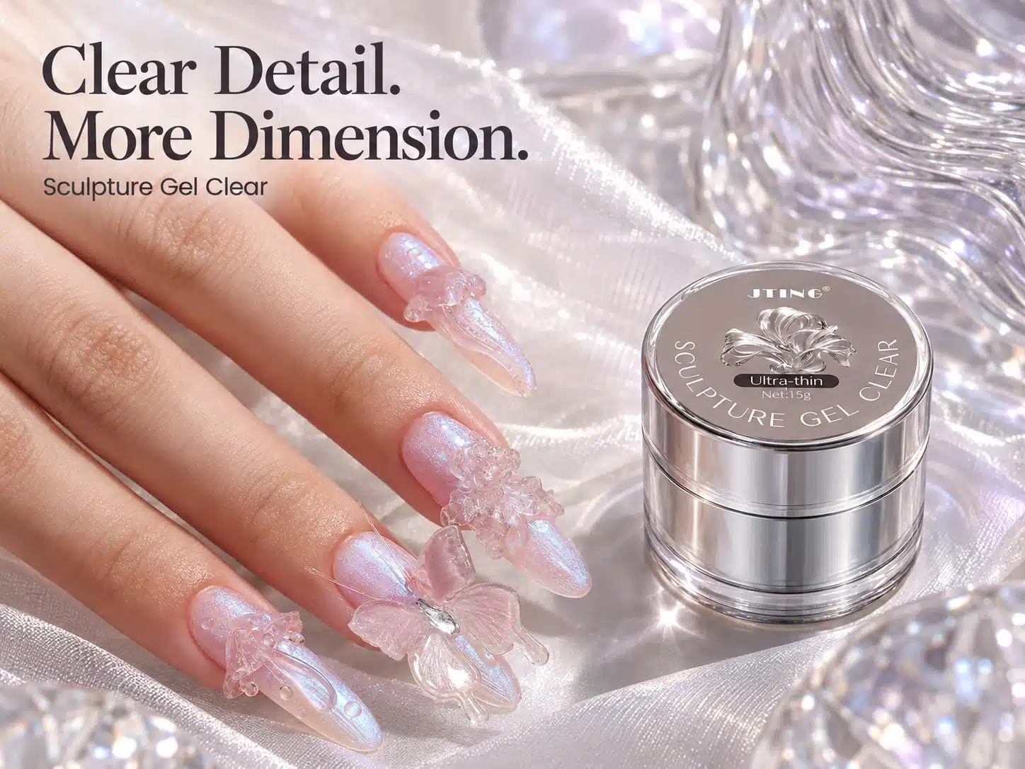 JTING Sculpture Gel Clear 15 g jar beside an iridescent manicure with clear sculpted butterflies and floral details