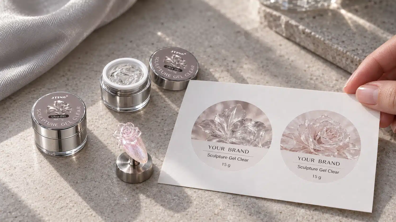 Clear Sculpture Gel Jar and Label Concepts Open and closed silver Sculpture Gel Clear jars beside a rose nail sample and paper label concepts