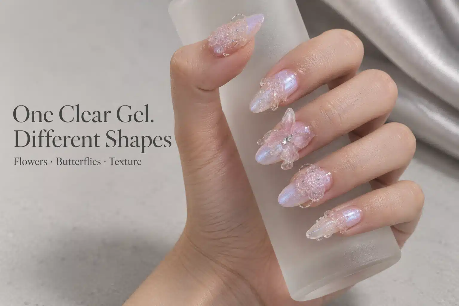 Clear Flowers, Butterflies and Nail Textures Hand holding frosted glass with clear roses, a butterfly and flowing details on pearlescent almond nails
