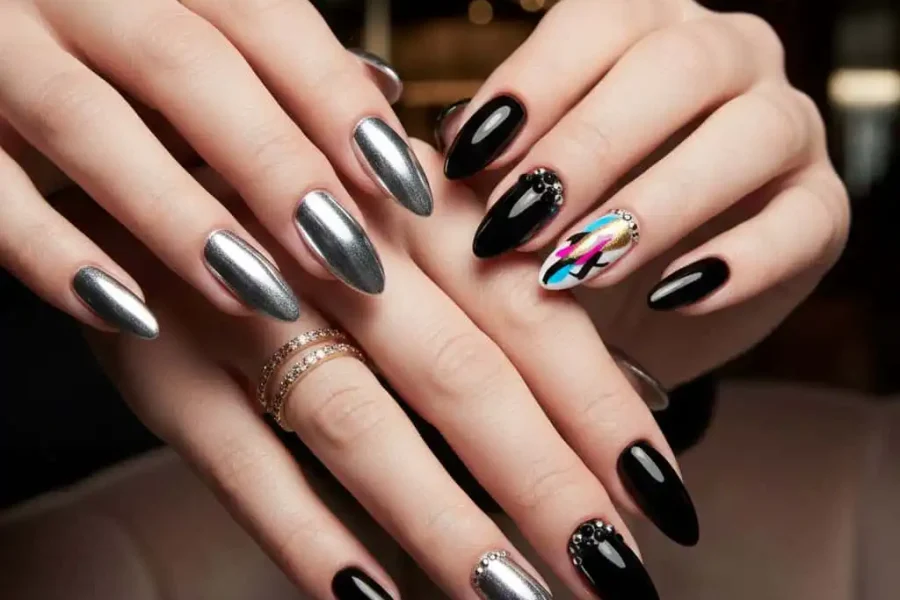 Glamorous black and silver stiletto nails with abstract accent.