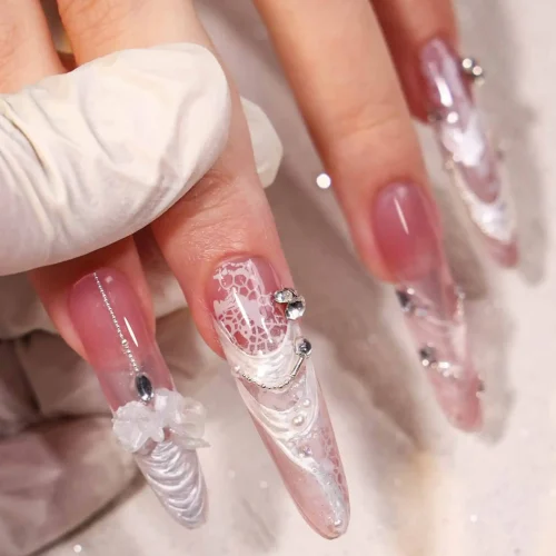 Pressing the solid gel onto the nail form for seamless extension application.